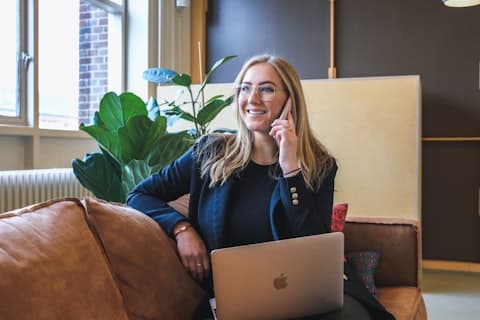 A friendly Wicket Travel support agent taking a customer call